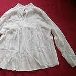 Элегантная кружевная блузка с воротником-стойкой