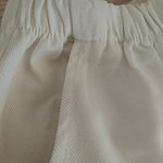Spodnie z szerokimi nogawkami w jednolitym kolorze z falbankami