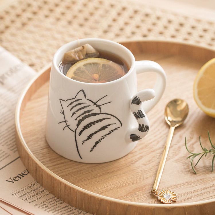 https://cdn.kawaiifashionshop.com/wp-content/uploads/2022/04/Cute-Cat-and-Dog-Pattern-Mug-3D-Tail-Ceramic-Cup-with-Spoon-Creative-StarBuck-Style-Coffee.jpg