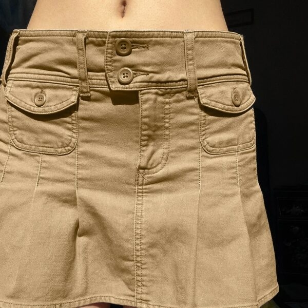 Minifalda vintage de cintura baja con bolsillo tejido