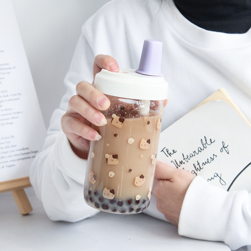 https://cdn.kawaiifashionshop.com/wp-content/uploads/2023/01/Kawaii-Cat-Boba-Glass-Water-Bottle-With-Straw-PU-Sleeve-Cute-Coffee-Bubble-Tea-Milk-Cups-1.jpg