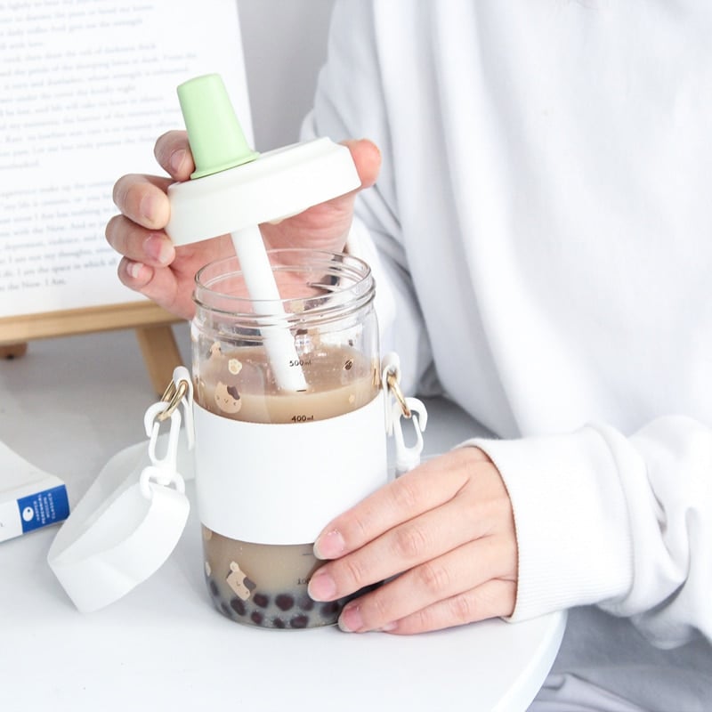 https://cdn.kawaiifashionshop.com/wp-content/uploads/2023/01/Kawaii-Cat-Boba-Glass-Water-Bottle-With-Straw-PU-Sleeve-Cute-Coffee-Bubble-Tea-Milk-Cups-3.jpg