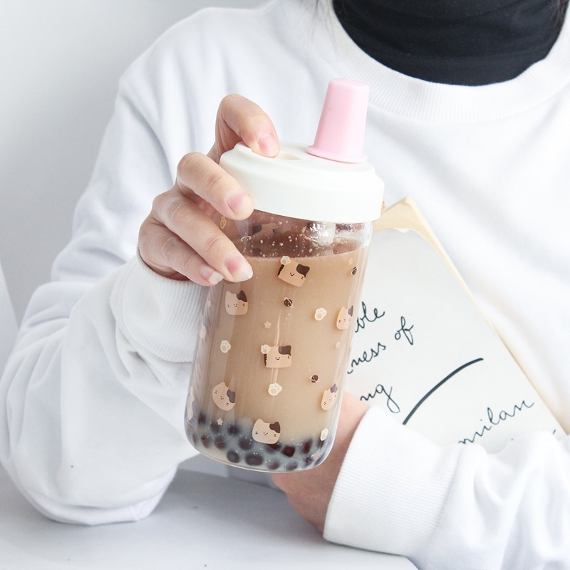 https://cdn.kawaiifashionshop.com/wp-content/uploads/2023/01/Kawaii-Cat-Boba-Glass-Water-Bottle-With-Straw-PU-Sleeve-Cute-Coffee-Bubble-Tea-Milk-Cups.jpg